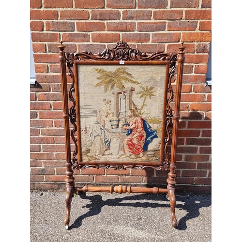 1092 - A large Victorian carved walnut and tapestry panelled fire screen, 132.5cm high x 85.5cm wide.... 