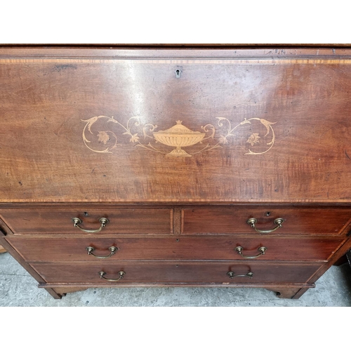 1097 - An Edwardian mahogany and inlaid bureau bookcase, 116cm wide.