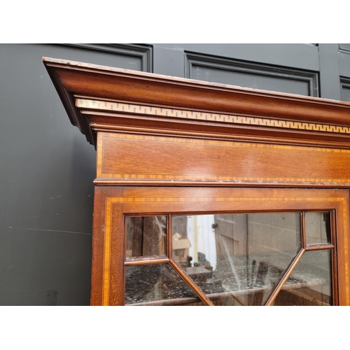 1097 - An Edwardian mahogany and inlaid bureau bookcase, 116cm wide.