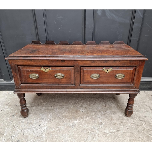 1098 - An 18th century oak two drawer side table, 131cm wide, (alterations).