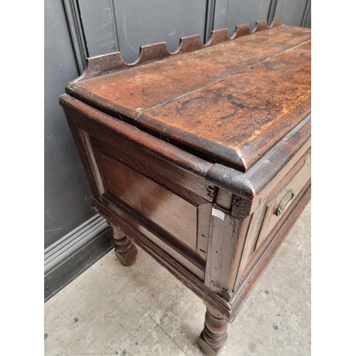 1098 - An 18th century oak two drawer side table, 131cm wide, (alterations).