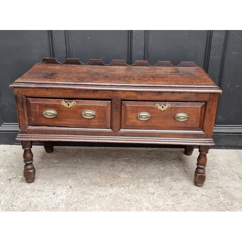 1098 - An 18th century oak two drawer side table, 131cm wide, (alterations).