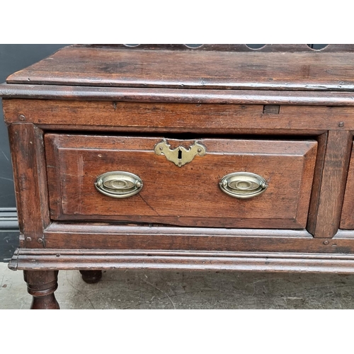 1098 - An 18th century oak two drawer side table, 131cm wide, (alterations).