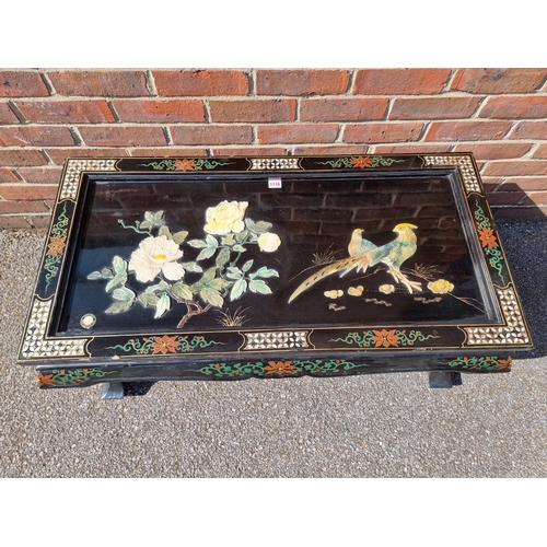 1116 - A Chinese black lacquer and soapstone rectangular low occasional table, 106cm wide.