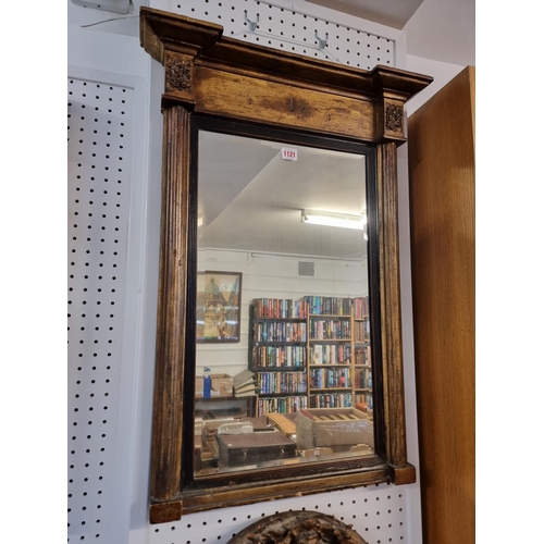 1121 - An early 19th century giltwood framed pier mirror, 78 x 56.5cm, (losses to frieze).