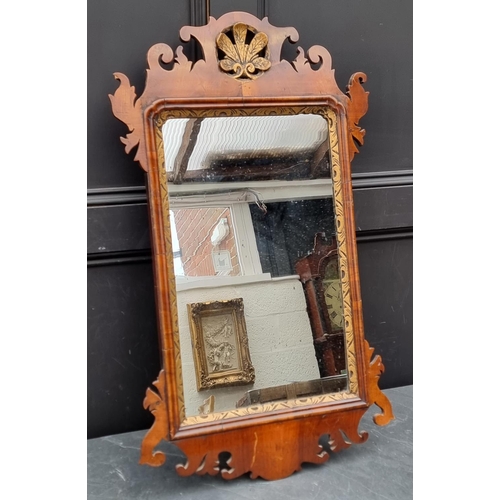 1123 - An 18th century walnut and parcel gilt fret frame wall mirror, 88 x 51cm, (minor losses).... 