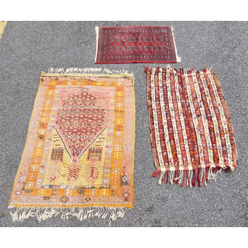 1126 - A flatweave rug, having floral and geometric borders 200 x 136cm; together with a Kelim rug; and a s... 