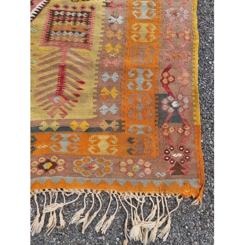 1126 - A flatweave rug, having floral and geometric borders 200 x 136cm; together with a Kelim rug; and a s... 