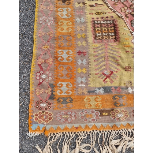 1126 - A flatweave rug, having floral and geometric borders 200 x 136cm; together with a Kelim rug; and a s... 