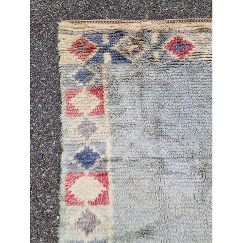 1127 - A Swedish rag rug, having geometric borders, 192 x 108cm.