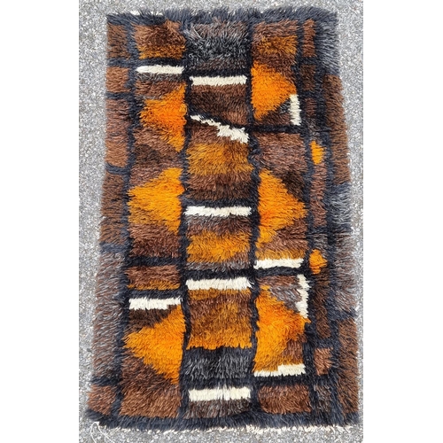 1129 - A Swedish Rya rug, having geometric central field, 139 x 79cm