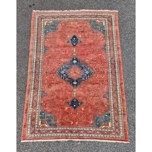 1132 - A Persian style rug, having central floral medallion, with floral cartouches to each corner, 255 x 1... 