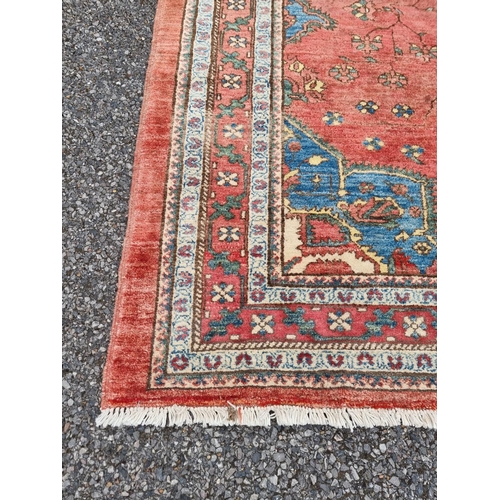 1132 - A Persian style rug, having central floral medallion, with floral cartouches to each corner, 255 x 1... 