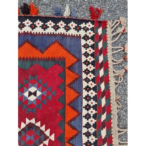 1134 - A Tribal Aztec rug, having allover geometric design, 270 x 158cm.