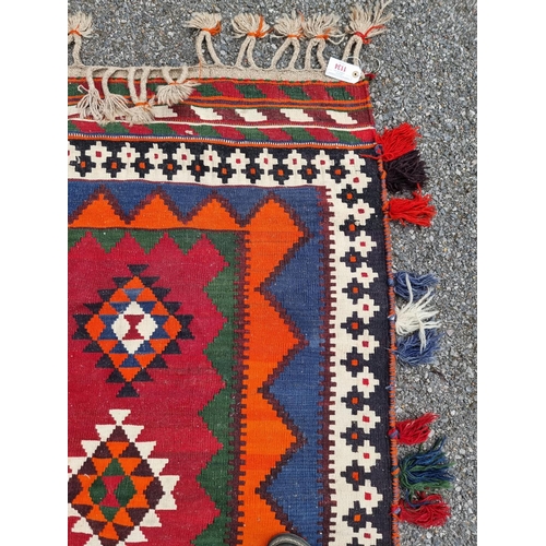 1134 - A Tribal Aztec rug, having allover geometric design, 270 x 158cm.