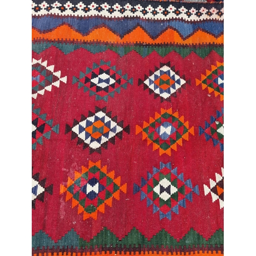 1134 - A Tribal Aztec rug, having allover geometric design, 270 x 158cm.