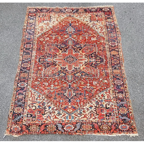 1140 - A Heriz carpet, having central floral medallion, with floral geometric borders, 400 x 295cm.... 