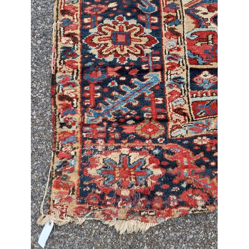 1140 - A Heriz carpet, having central floral medallion, with floral geometric borders, 400 x 295cm.... 