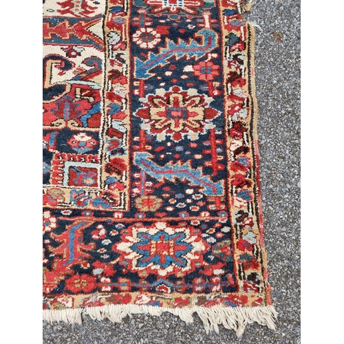 1140 - A Heriz carpet, having central floral medallion, with floral geometric borders, 400 x 295cm.... 