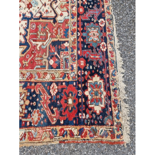 1140 - A Heriz carpet, having central floral medallion, with floral geometric borders, 400 x 295cm.... 