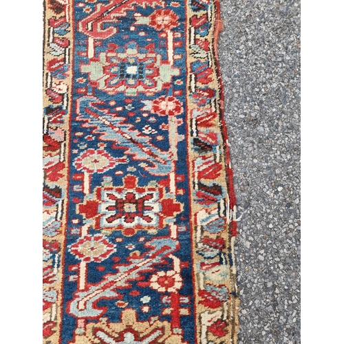 1140 - A Heriz carpet, having central floral medallion, with floral geometric borders, 400 x 295cm.... 