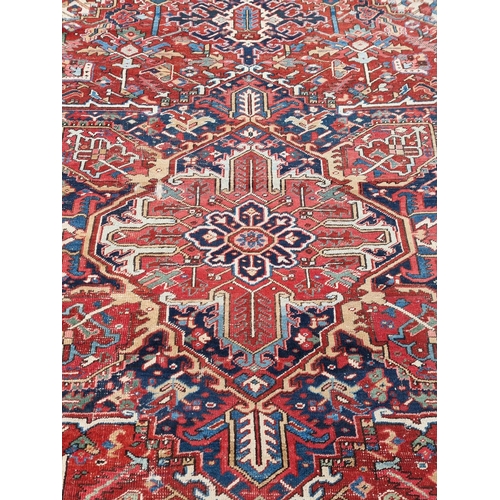 1140 - A Heriz carpet, having central floral medallion, with floral geometric borders, 400 x 295cm.... 