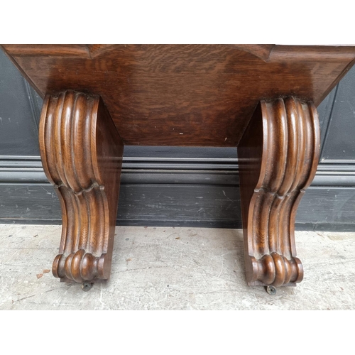 1240 - A large oak clock bracket, 34cm high x 53.5cm wide.