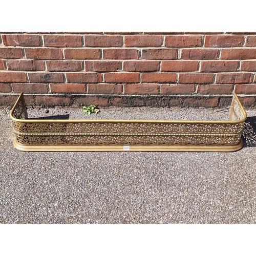 1241 - A Victorian pierced brass fender, 126cm wide.