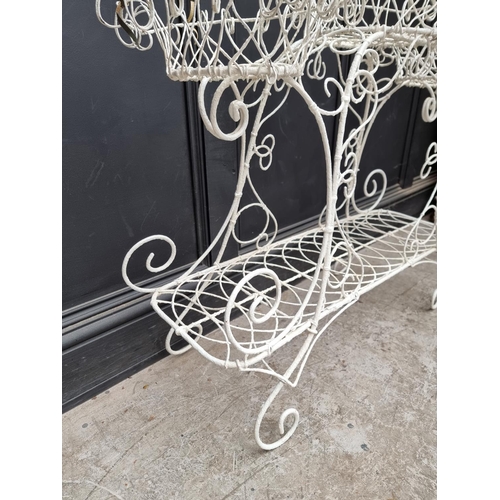 1242 - A 19th century white painted wirework plant stand, 79cm high x 92cm wide.