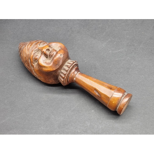 1627 - A 19th century Continental carved walnut novelty nutcracker, 15.5cm long.