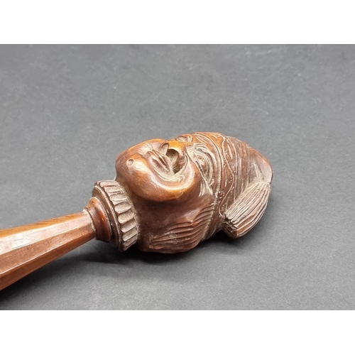 1627 - A 19th century Continental carved walnut novelty nutcracker, 15.5cm long.