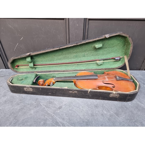 1644 - An antique Continental violin, with 14in two-piece back, with bow, in ebonised case.... 