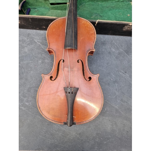 1644 - An antique Continental violin, with 14in two-piece back, with bow, in ebonised case.... 