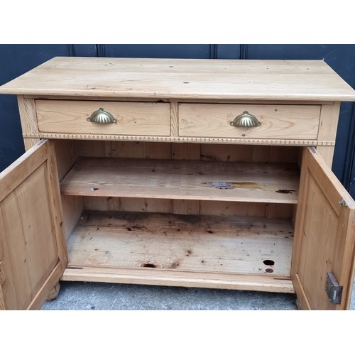 1053 - A 19th century continental pine side cabinet, 109cm wide.