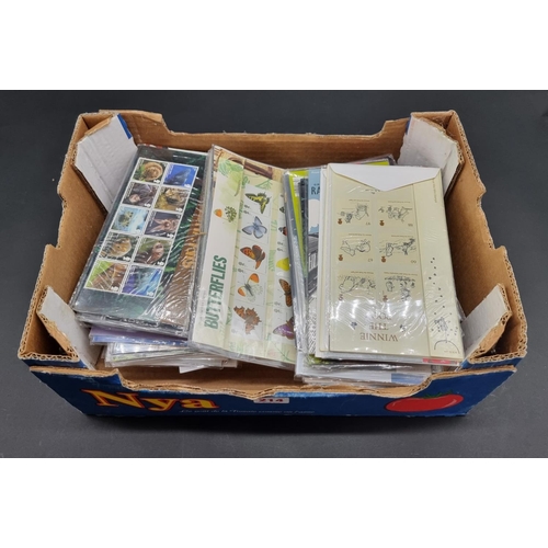 214 - MINT STAMPS: a quantity in original packaging. (Box)