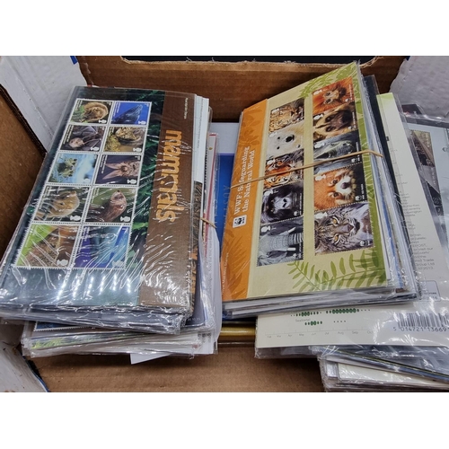 214 - MINT STAMPS: a quantity in original packaging. (Box)