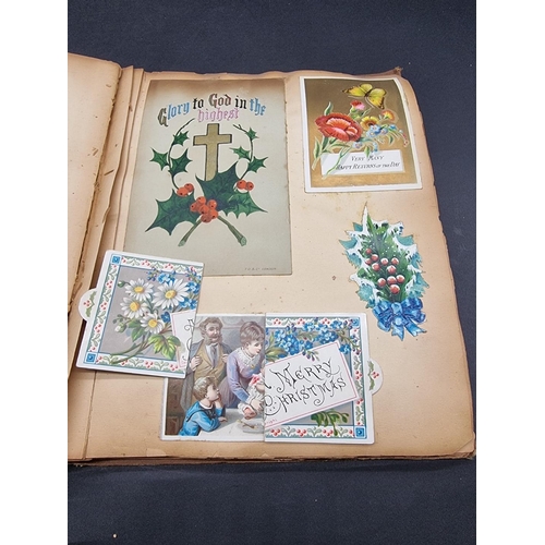 223 - SCRAP ALBUMS: three albums of greetings cards and chromolithographic scraps, late 19th-early 20... 