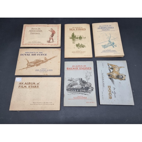 246 - A MIXED LOT: to include photograph albums, cigarette cards and stamps, plus a manuscript bill for ca... 