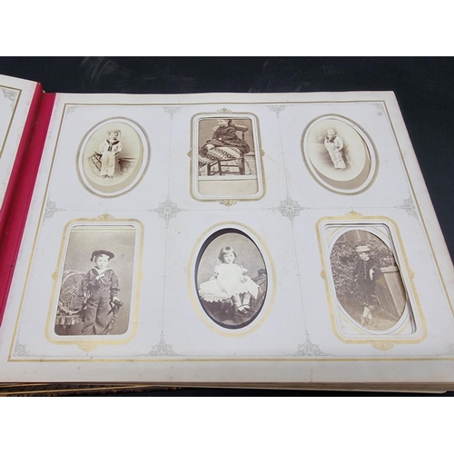 36 - CARTE DE VISITE ALBUM: a mid-Victorian album containing numerous window mounted cdv & cabinet ca... 