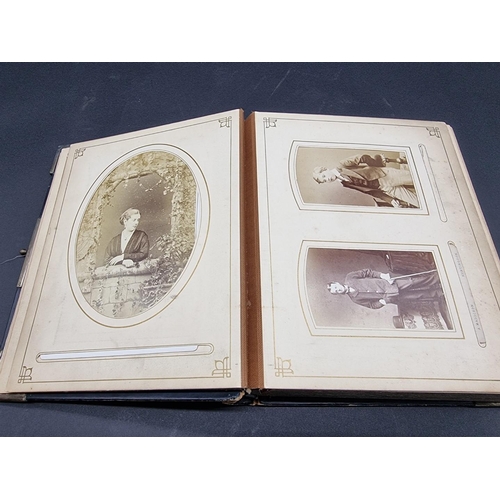 36 - CARTE DE VISITE ALBUM: a mid-Victorian album containing numerous window mounted cdv & cabinet ca... 