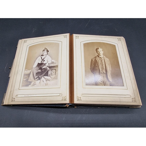 36 - CARTE DE VISITE ALBUM: a mid-Victorian album containing numerous window mounted cdv & cabinet ca... 