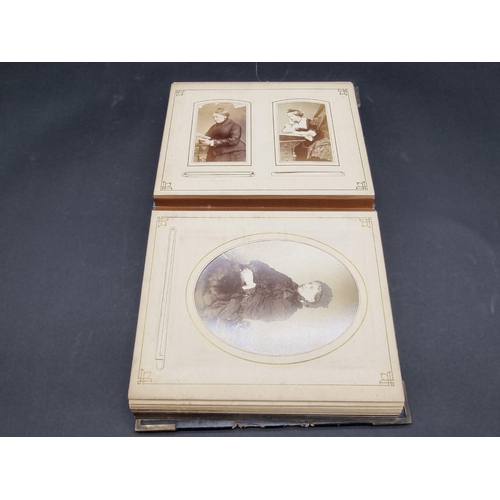 36 - CARTE DE VISITE ALBUM: a mid-Victorian album containing numerous window mounted cdv & cabinet ca... 