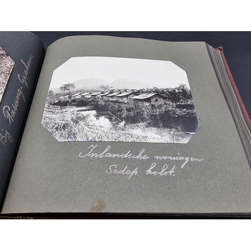 47 - INDONESIA: PHOTOGRAPH ALBUM: containing approx 200 corner mounted original photographs mostly of col... 