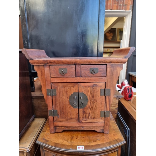 1015 - A miniature Chinese pine altar cabinet, 45cm high x 50cm wide.