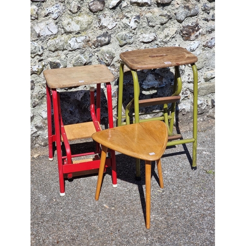 1099 - Two vintage beech and painted tubular metal metamorphic stools; together with a vintage beech triang... 