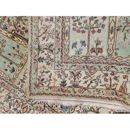 1136 - A Persian style rug, having garden design to central field, with animals and flowers to borders, 244... 