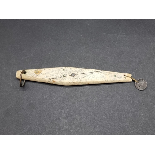 1628 - An antique Inuit marine ivory fishing lure, with attached 1855 US half dime coin, total length ... 