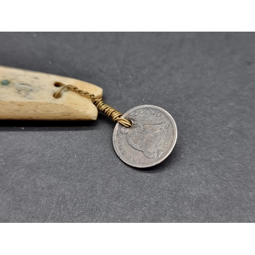 1628 - An antique Inuit marine ivory fishing lure, with attached 1855 US half dime coin, total length ... 