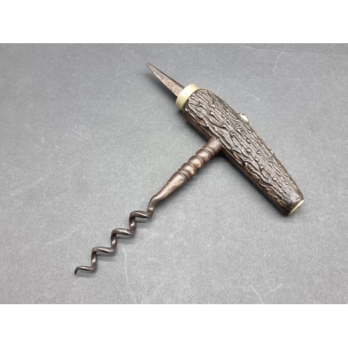 1634 - An early 1900 stag antler direct pull corkscrew with spike. 