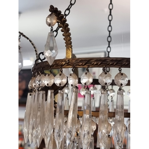 1640 - An old brass and faceted glass drop four tier chandelier, 31.5cm diameter x 36cm high; together with... 